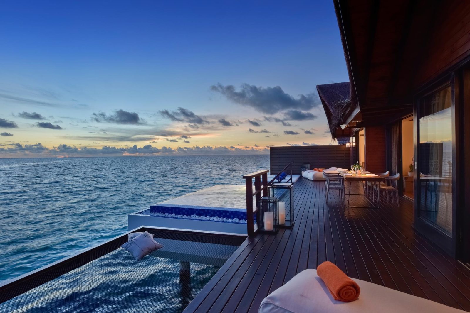 Grand Park Maldives — overwater villa at sunset