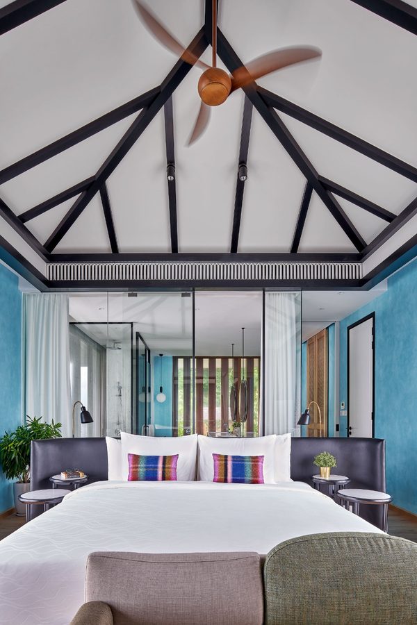 Khem Beach Resort — bedroom beneath a gabled ceiling